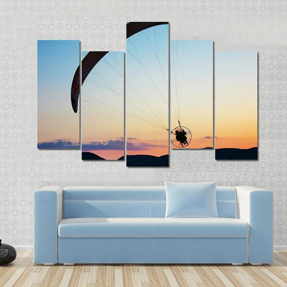 Paragliding Over The Hills At Sunset Canvas Wall Art