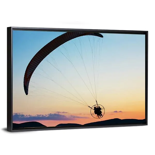 Paragliding Over The Hills At Sunset Canvas Wall Art
